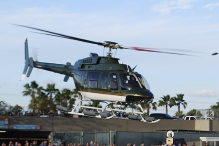 Harrison Ford at the controls of his Bell 407GX helicopter taking-off on the last day of Heli-Expo 2014.